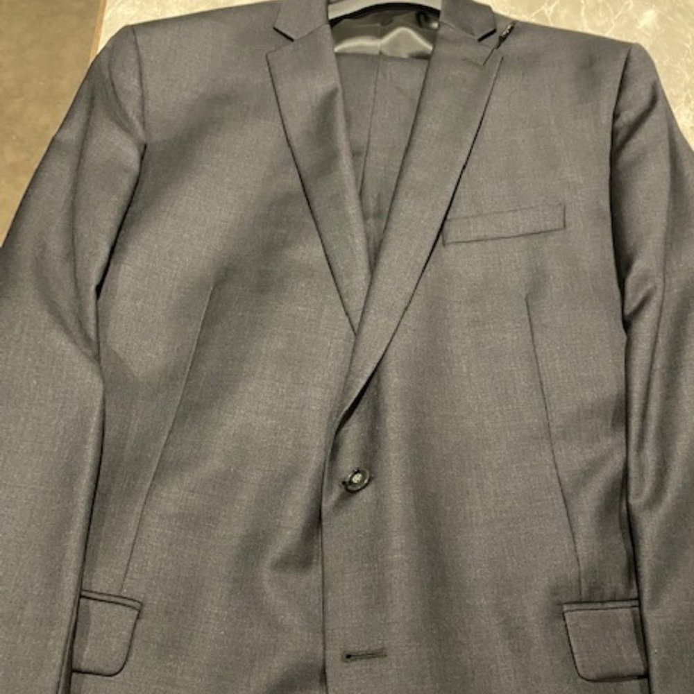 PRICE DROP!!  Calvin Klein two piece gray suit.  NEW With Tags